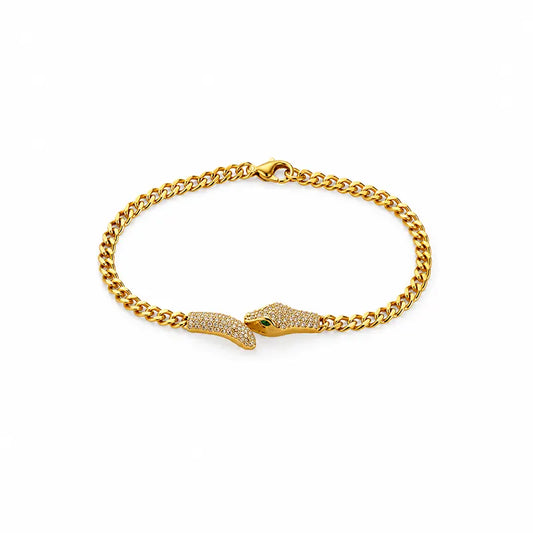 Gold chain bracelet with snake head clasp on a white background