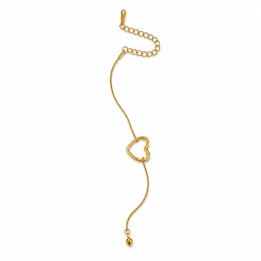 Gold bracelet with a heart-shaped clasp on a white background