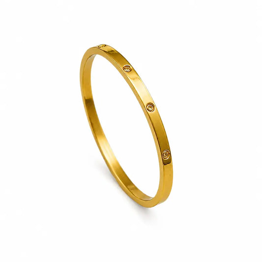 Gold bracelet on a white background