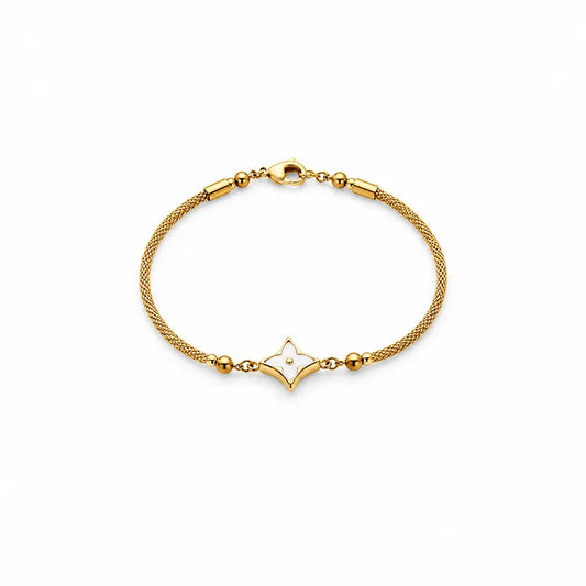 Gold bracelet with a star-shaped clasp on a white background 